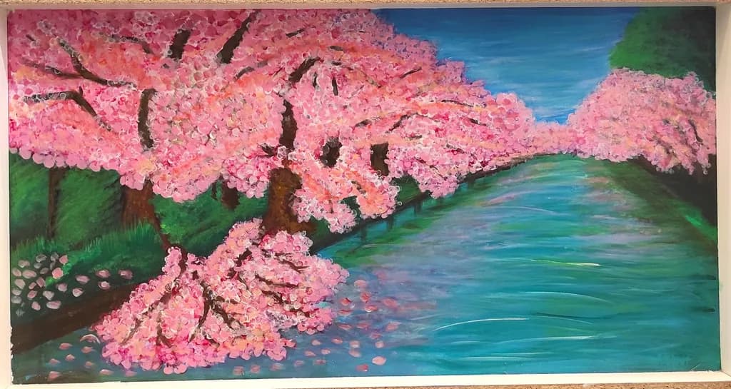 Serenity in Bloom: A Tranquil Landscape of Pink Blossoms by the Water