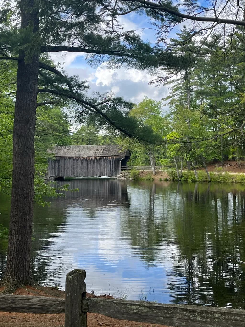 Whispers of Serenity: A Tranquil Reflection by the Old Covered Bridge