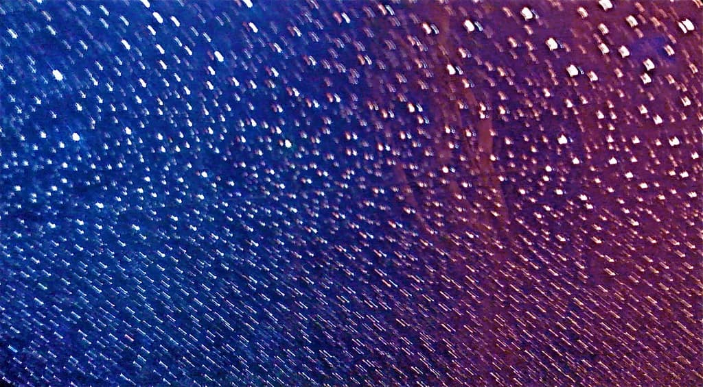 Celestial Rain: A Dance of Light and Color in the Night Sky