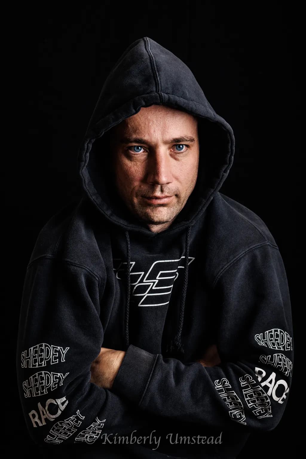 Mysterious Intensity: A Portrait in Shadows and Hoodie