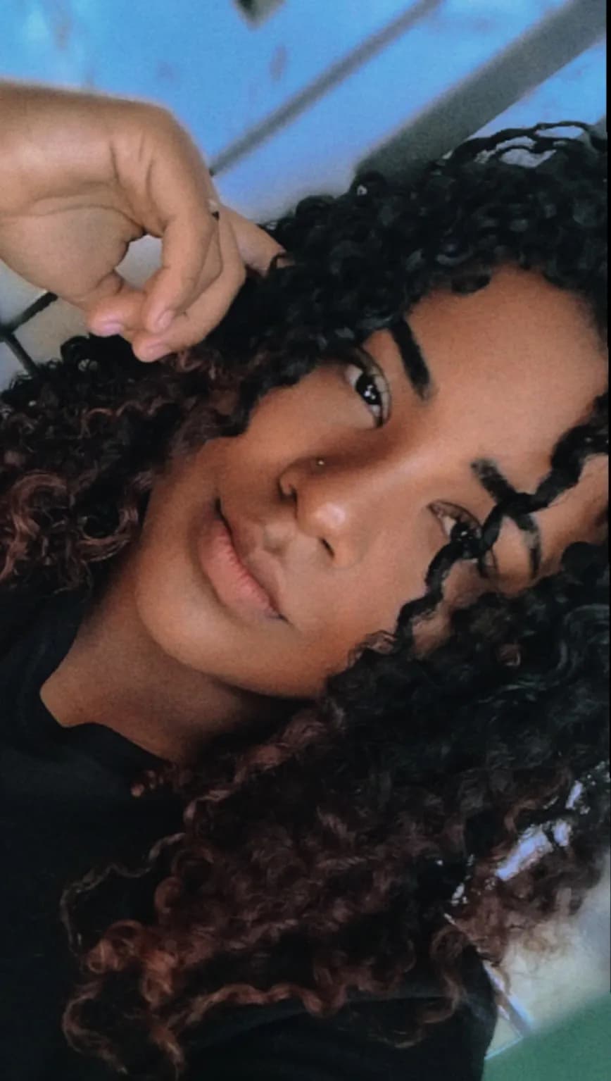 Whispers of Curly Elegance: A Portrait of Natural Beauty