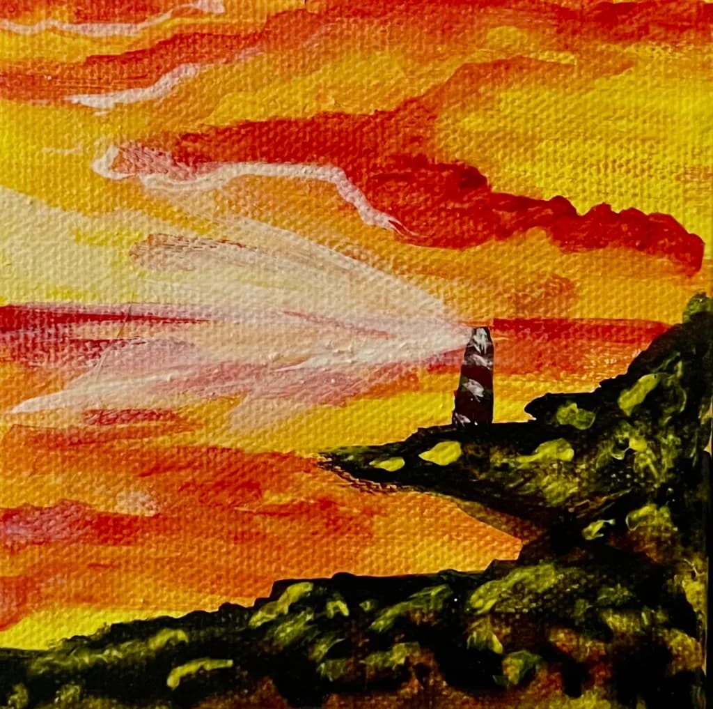 Guiding Light: A Vibrant Sunset Over the Lighthouse Shoreline