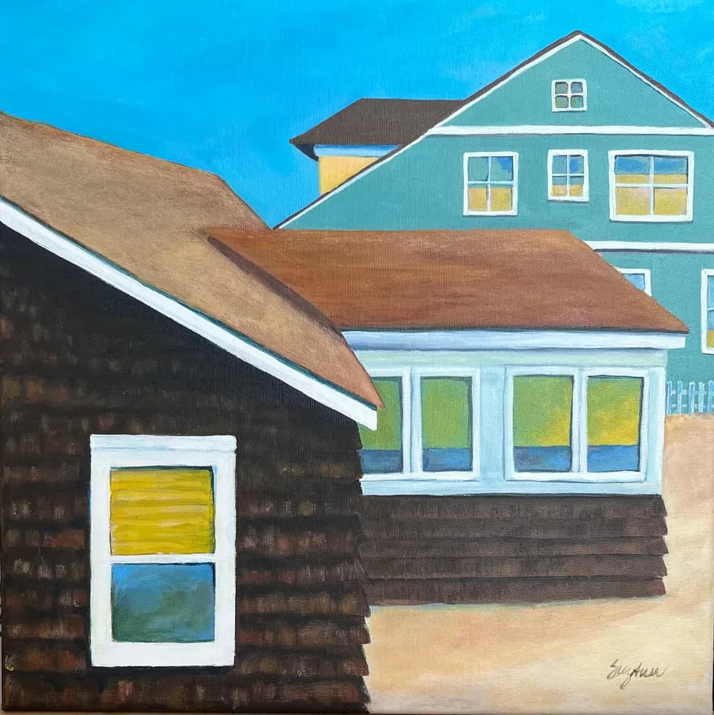 Coastal Harmony: A Serene View of Colorful Homes Under a Bright Sky