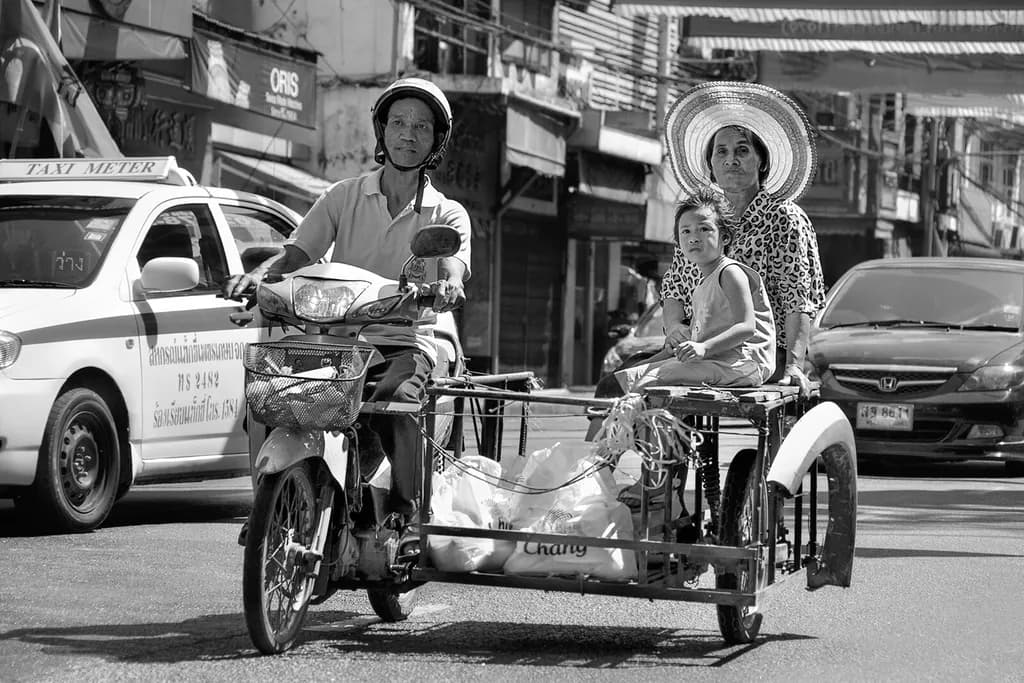 Urban Family Journey: A Black and White Exploration of Transportation and Togetherness