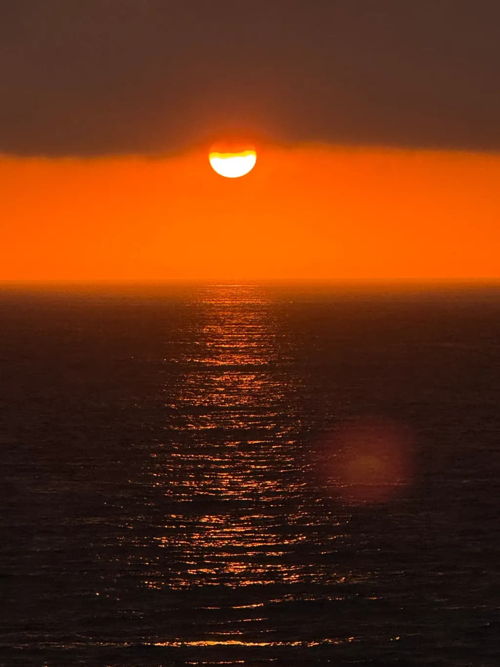 Ethereal Sunset: A Dance of Light on Tranquil Waters