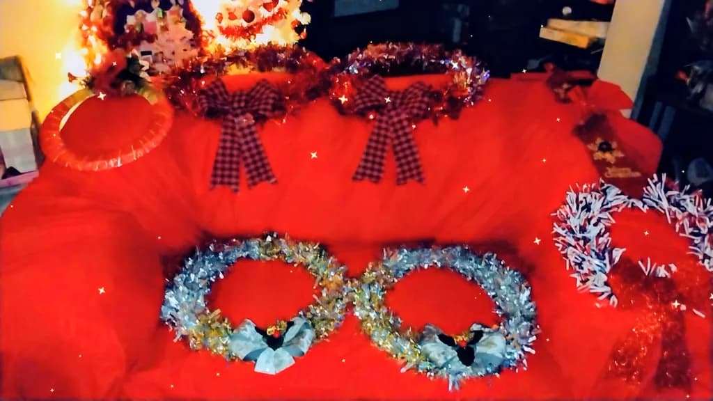 Festive Elegance: A Cozy Holiday Couch Adorned with Colorful Wreaths and Cheerful Accents