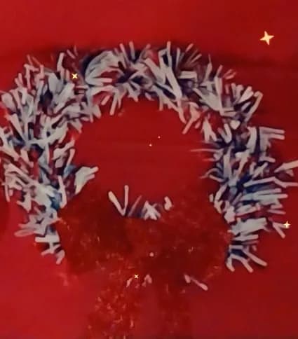 Festive Whimsy: A Red and White Wreath with Sparkling Charm