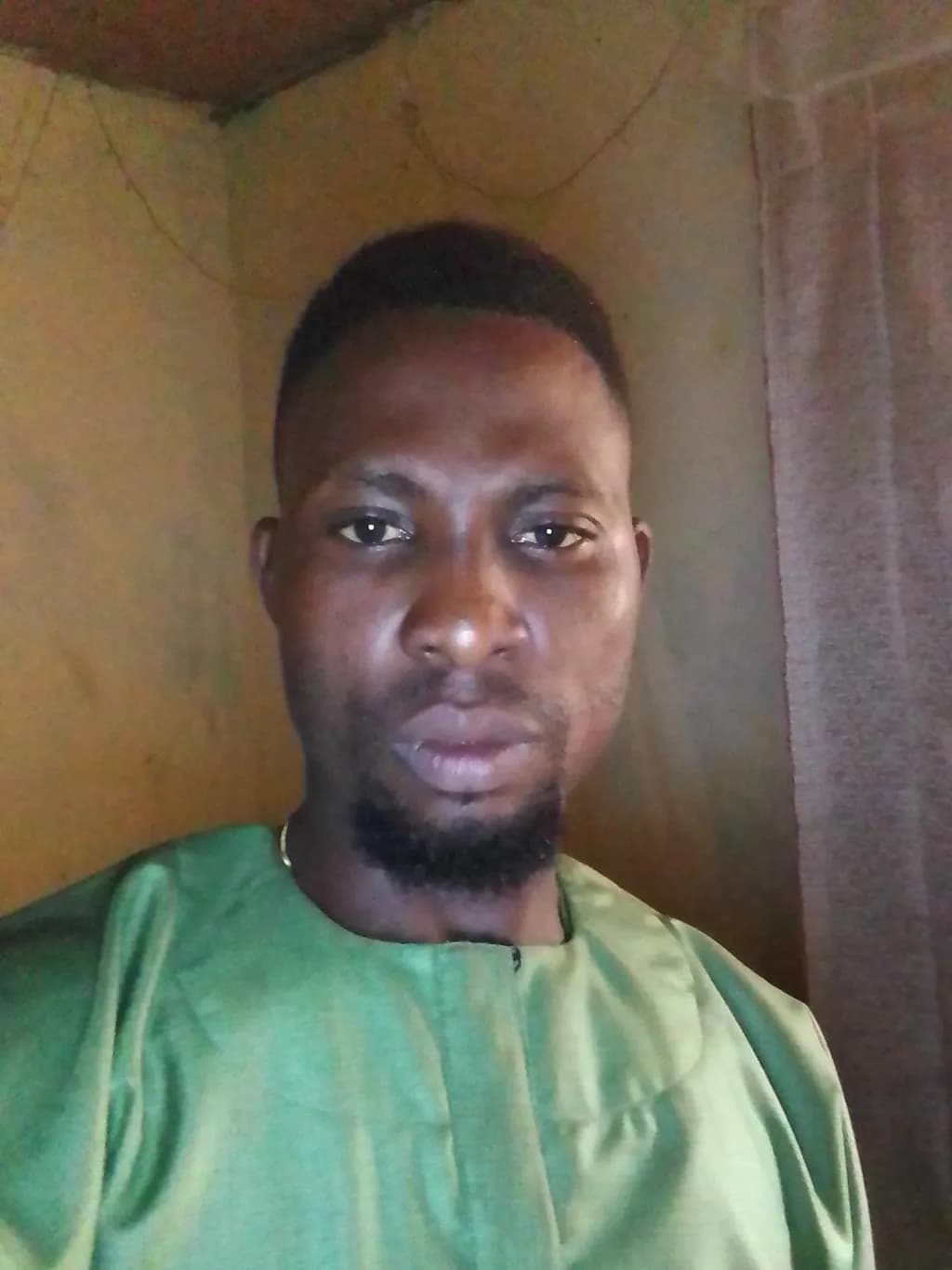 Emerging Strength: A Portrait of Resilience in Green Attire