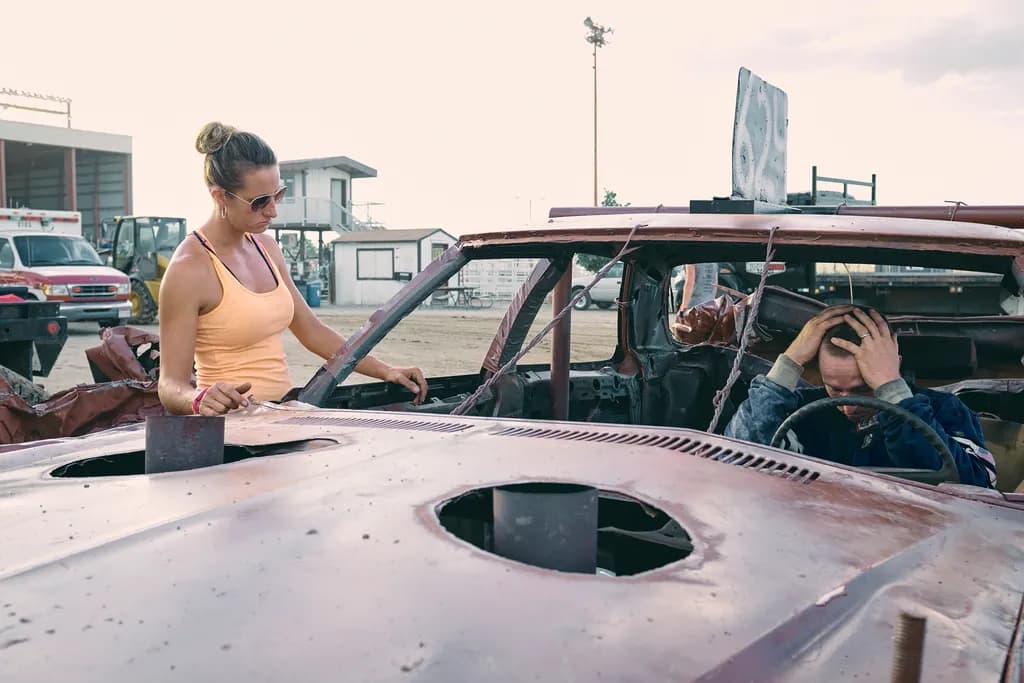 "Emotional Collision: A Moment of Reflection in the Demolition Derby"