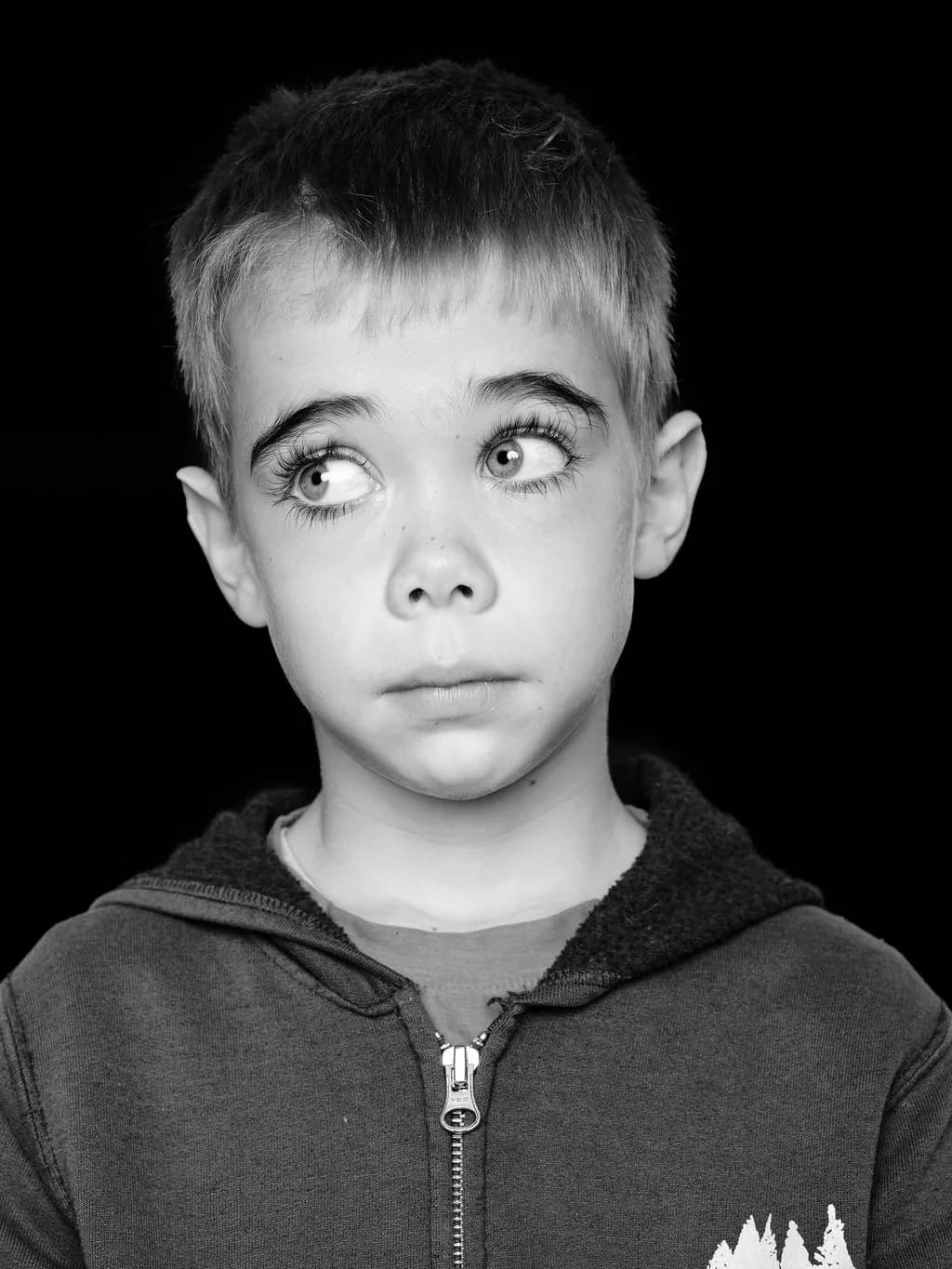 Whispers of Innocence: A Monochrome Portrait of Curiosity and Thoughtfulness
