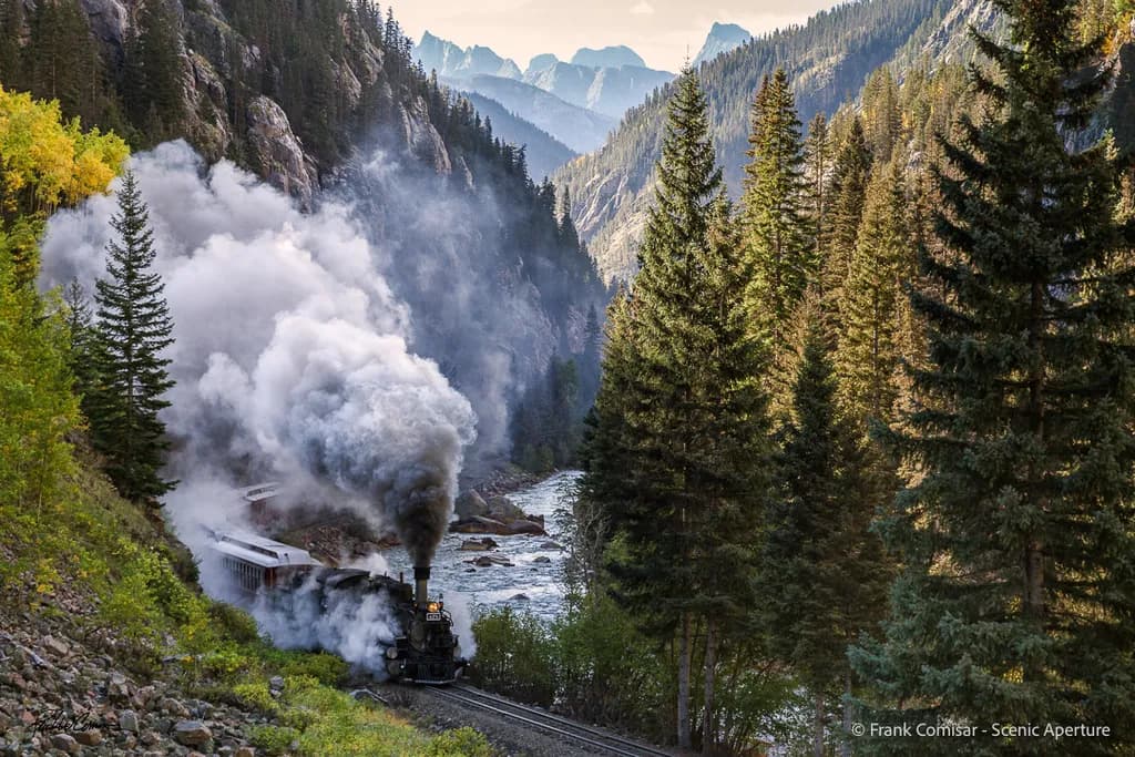 Steam Train Through Mountains