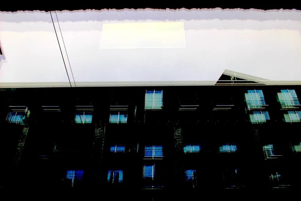 Urban Reflections: A Geometric Dance of Light and Shadow in Architectural Windows