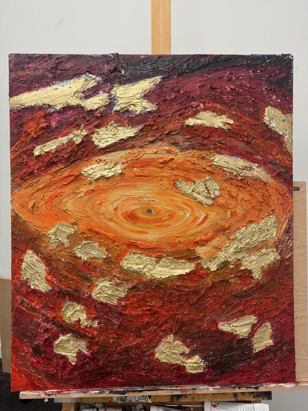Celestial Whirl: A Dance of Gold and Crimson in Abstract Form