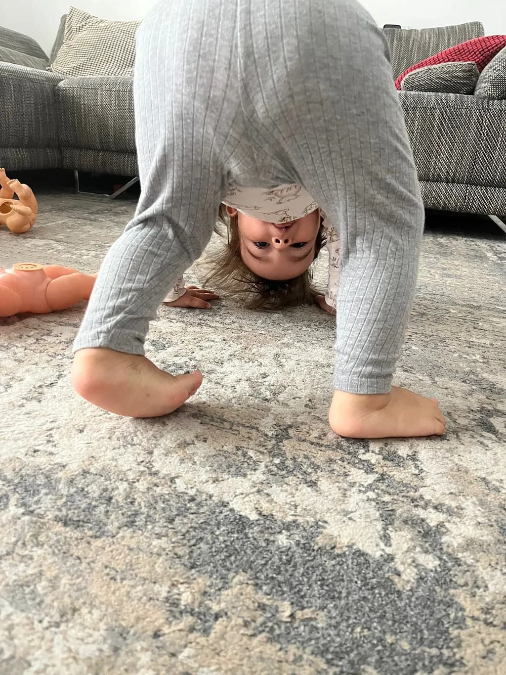 Whimsical Upside-Down Playtime: A Child's Joyful Exploration of the World from a New Perspective
