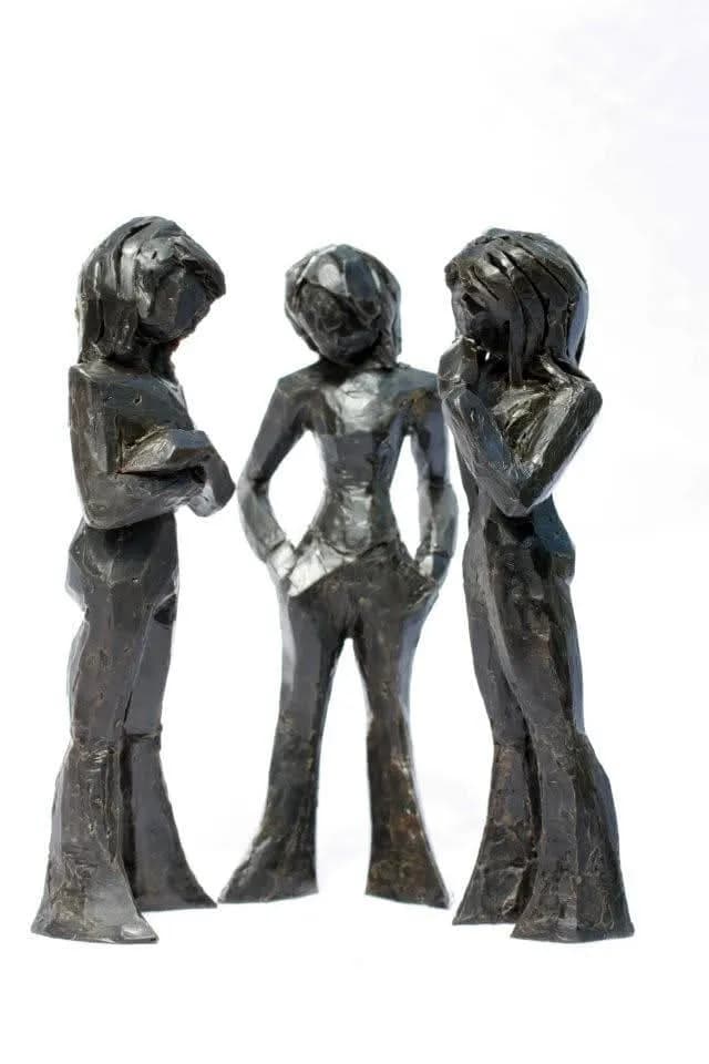 Whispers of Connection: A Trio of Thoughtful Figures in Sculpted Form