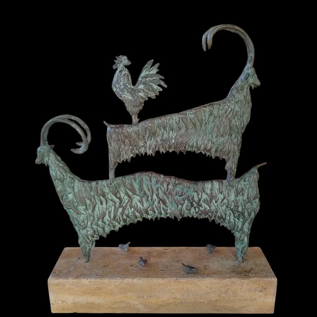 Whimsical Harmony: A Bronze Sculpture of Goats and Rooster in Nature's Embrace