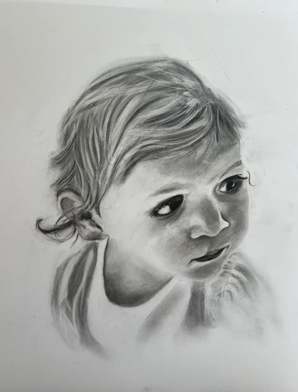 Whispers of Innocence: A Charcoal Portrait of Childhood Wonder