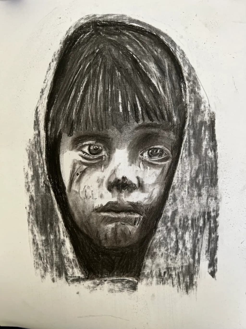 Whispers of Innocence: A Charcoal Portrait of Resilience