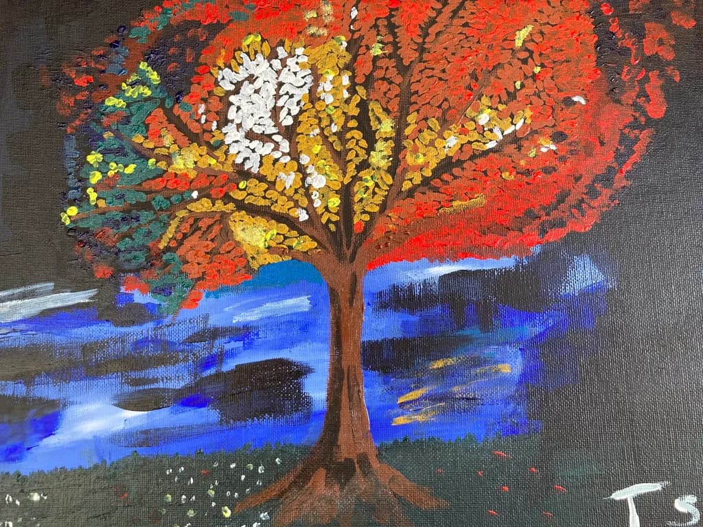 Autumn's Embrace: A Vibrant Landscape of Colorful Trees and Serene Skies