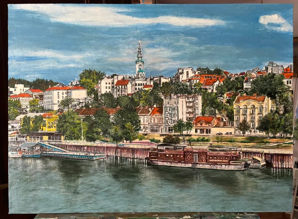 Serene Waters: A Vibrant Cityscape by the Riverbank