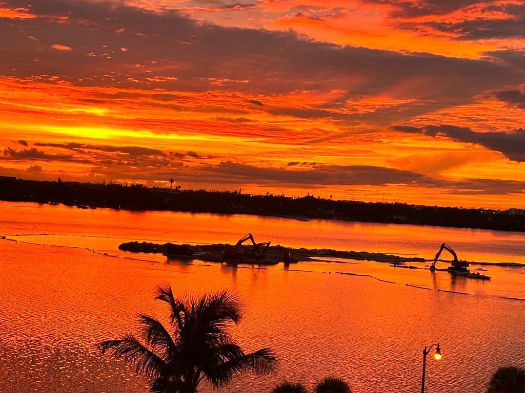 Sunset Symphony: A Vibrant Dance of Colors Over Tranquil Waters