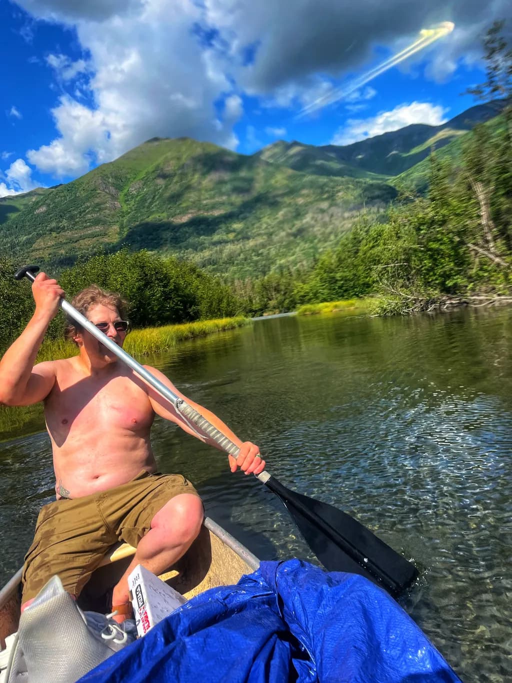 Canoeing Through Nature's Majesty: A Journey Among Mountains and Water