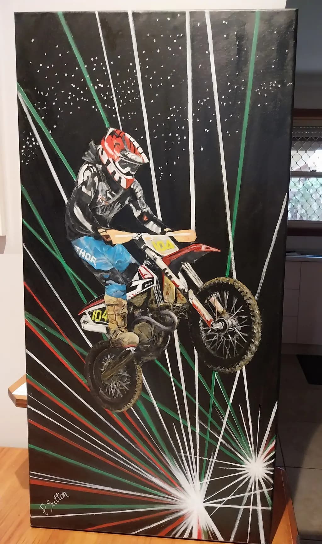 Dynamic Flight: A Stunt Rider's Leap Through Colorful Lights