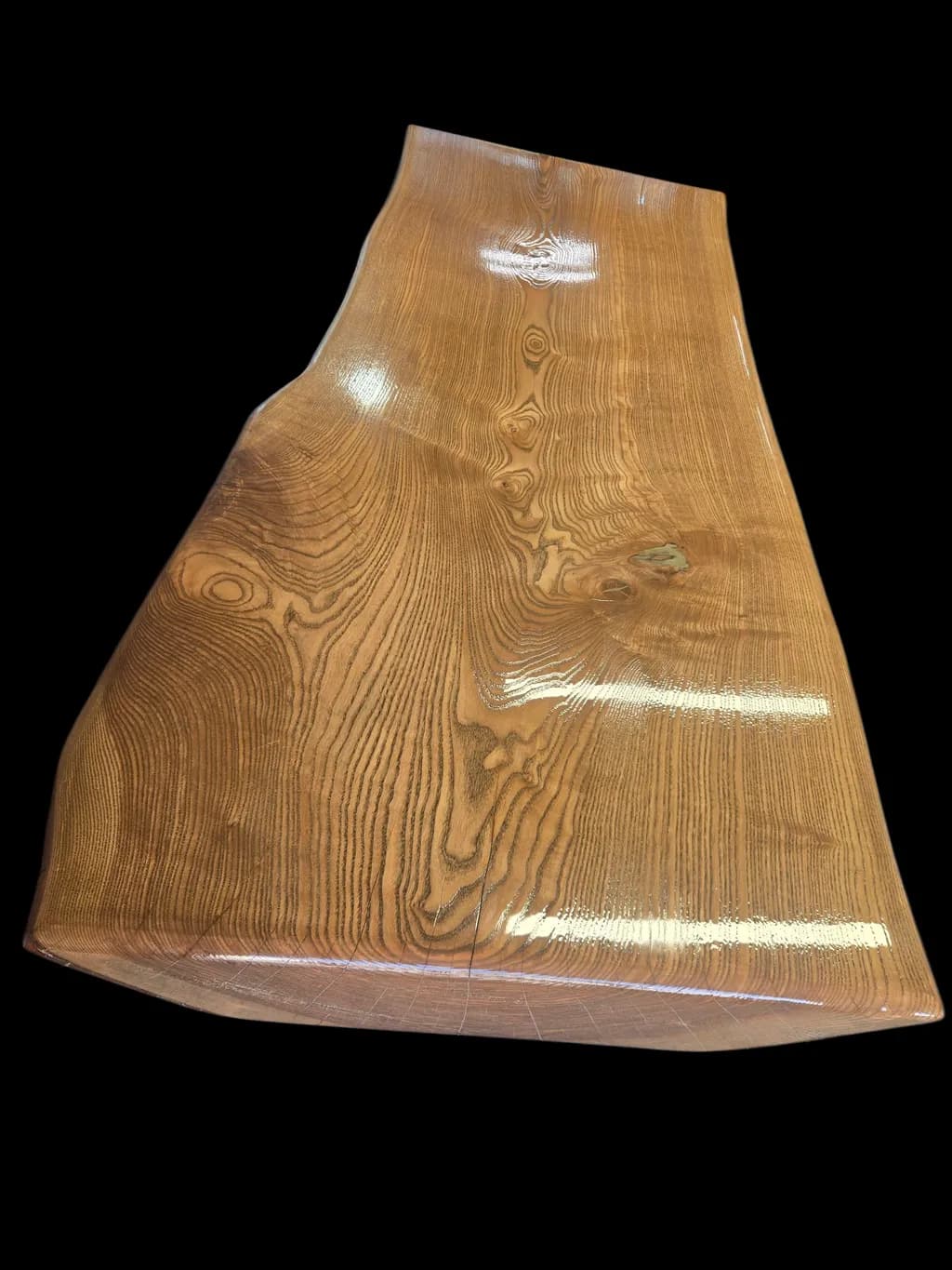 Natural Elegance: A Handcrafted Wooden Table with Unique Grain Patterns and Glossy Finish
