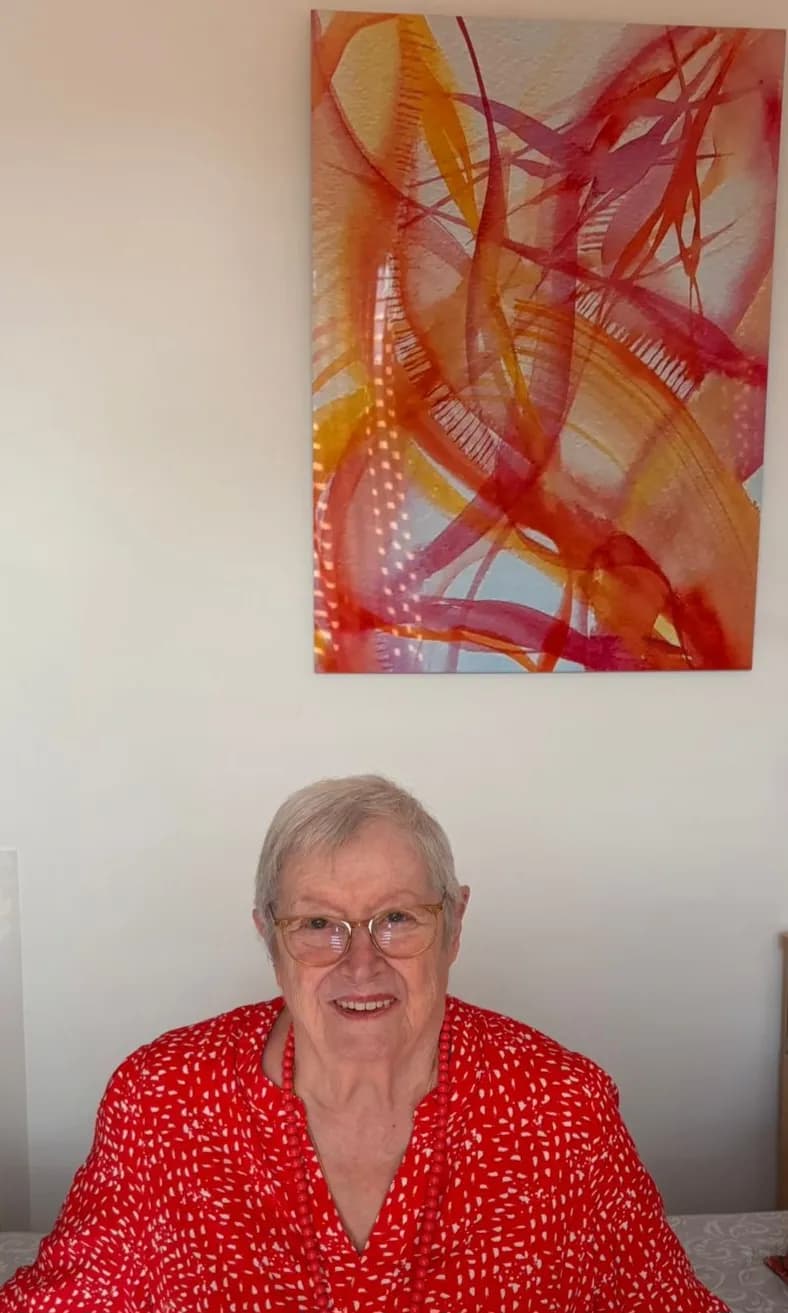 Radiant Smiles: A Portrait of Joy in Red Hues