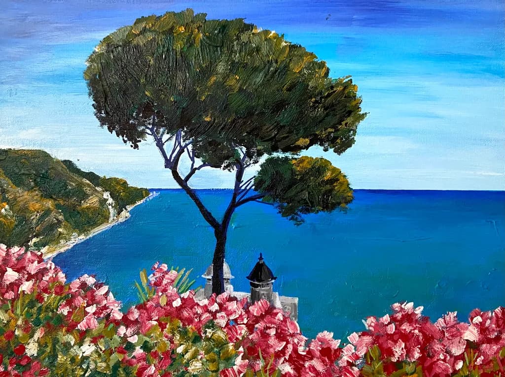 Serenity by the Sea: A Vibrant Landscape of Trees and Blossoms Under a Clear Sky