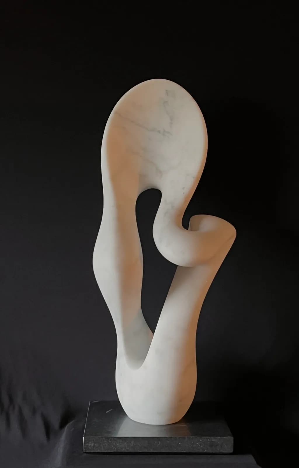 Elegant Whispers: A Modern Abstract Marble Sculpture Embracing Fluidity and Form
