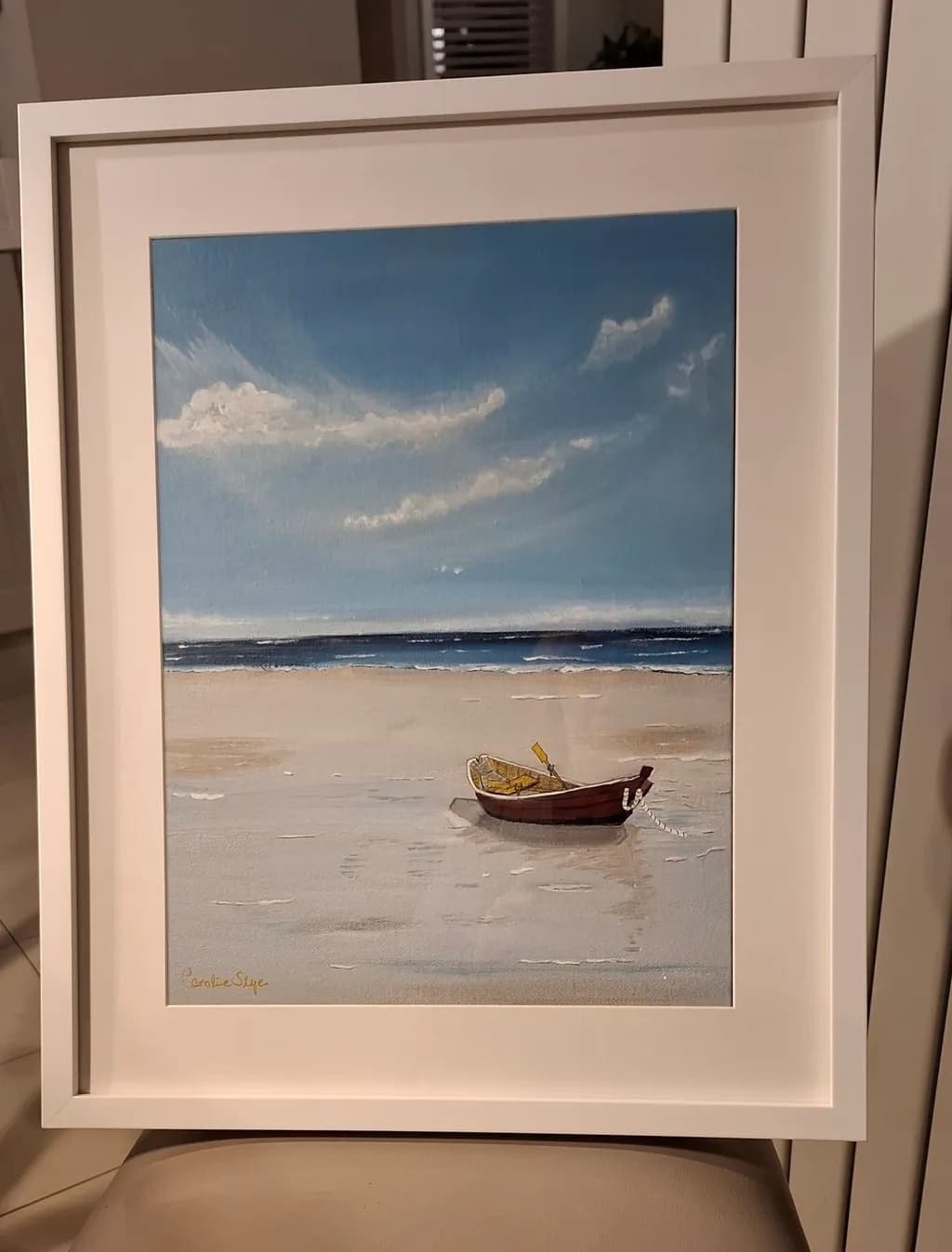 Serenity by the Shore: A Tranquil Seascape with a Lone Boat on the Beach