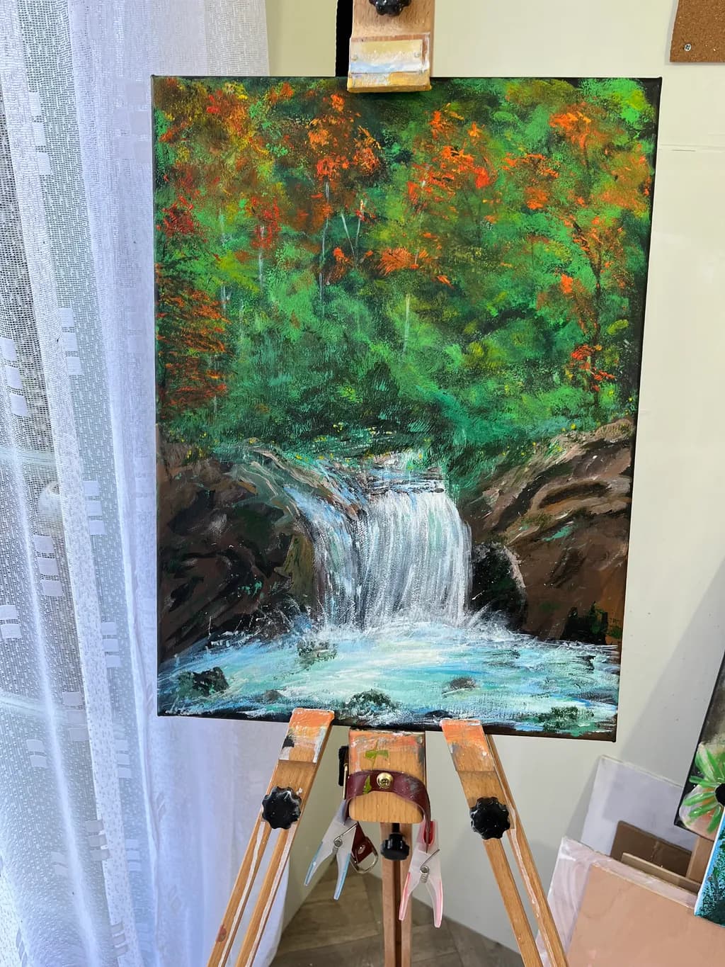 Whispers of Autumn: A Serene Waterfall Amidst Vibrant Foliage