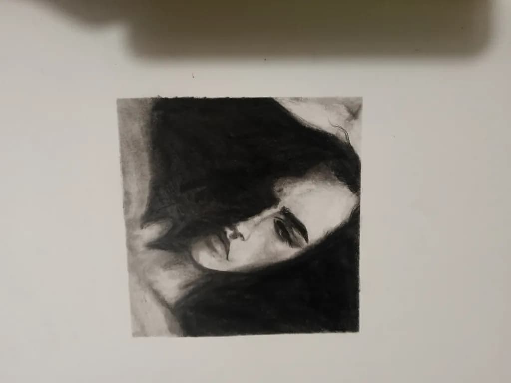 Whispers of Shadows: A Contemplative Portrait in Charcoal