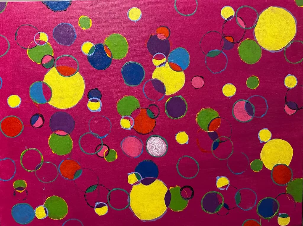 Vibrant Whimsy: A Playful Dance of Colorful Geometric Circles on Pink Canvas