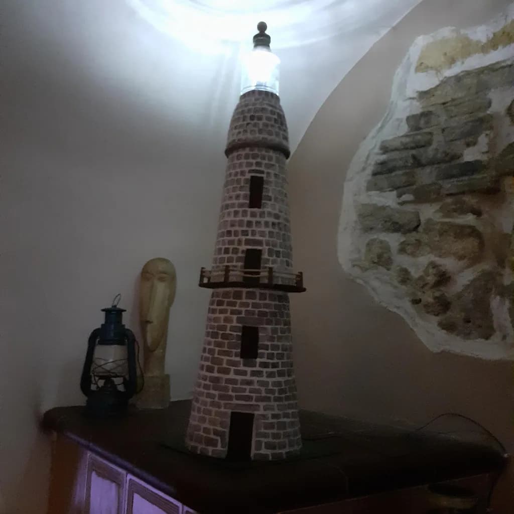 Illuminated Beacon: A Whimsical Lighthouse Sculpture for Home Decor