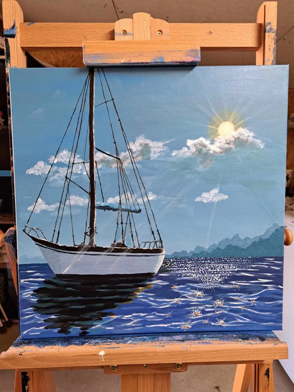 Serenity at Sea: A Tranquil Sailboat Journey Under a Sunlit Sky