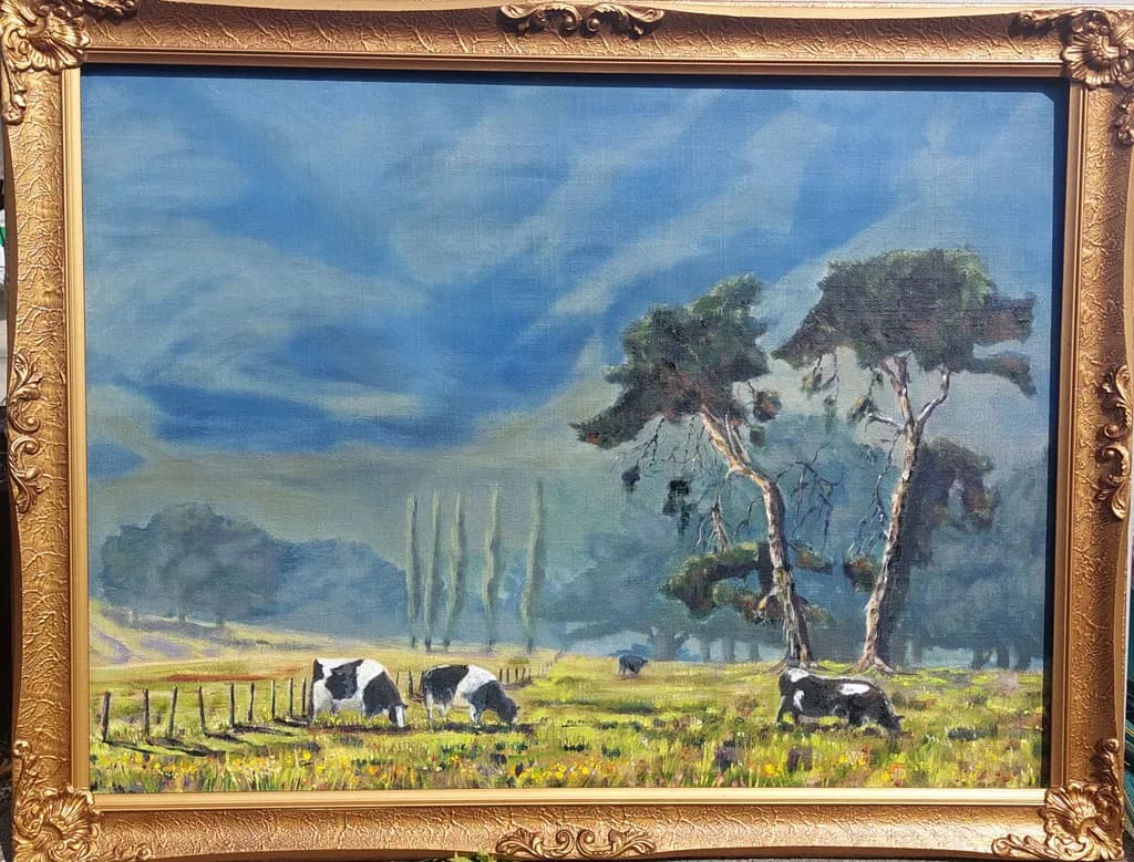 Serene Pastoral Harmony: Cows Grazing Under a Tranquil Blue Sky