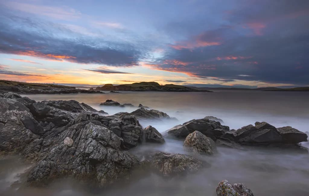 Serenity at Dusk: A Coastal Symphony of Rocks and Waves