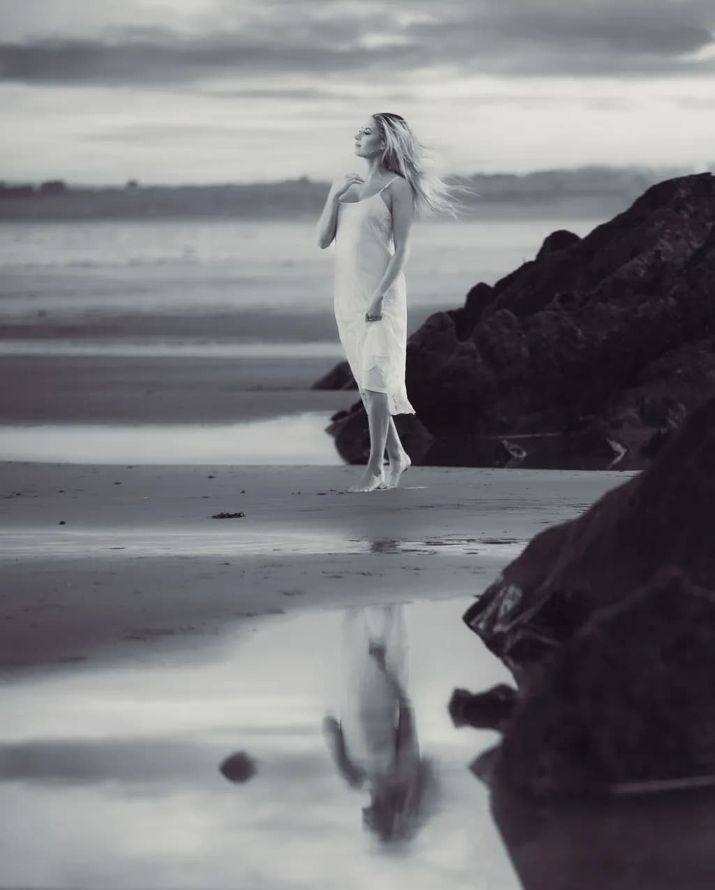 Whispers of Solitude: A Serene Monochrome Reflection on the Beach