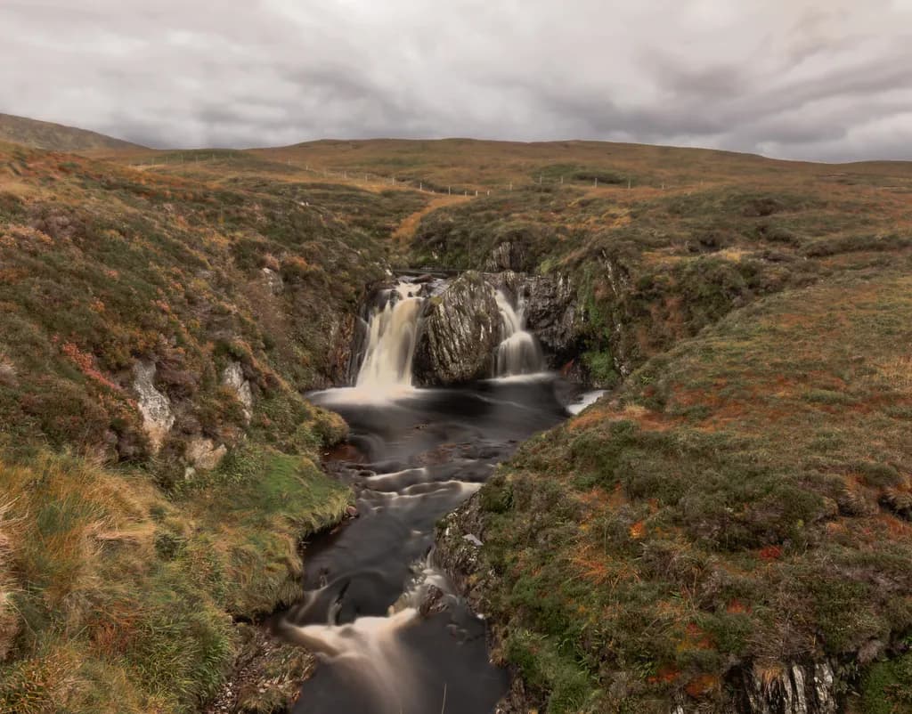 Whispers of the Shetland Highlands: A Serene Waterfall's Journey Through Time and Nature