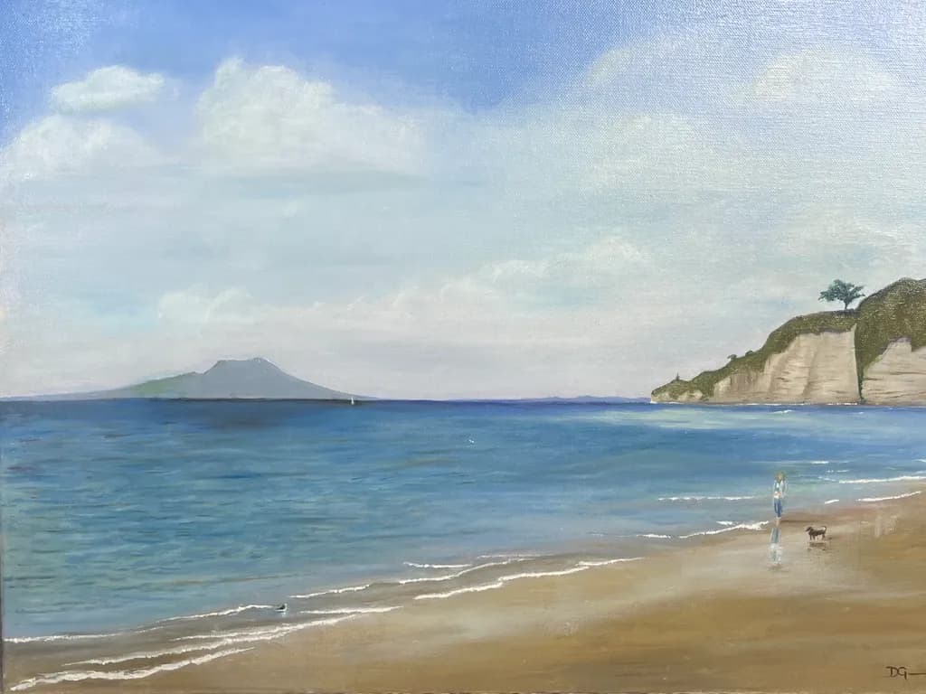 Serenity by the Shore: A Tranquil Beach Scene with Gentle Waves and a Distant Island