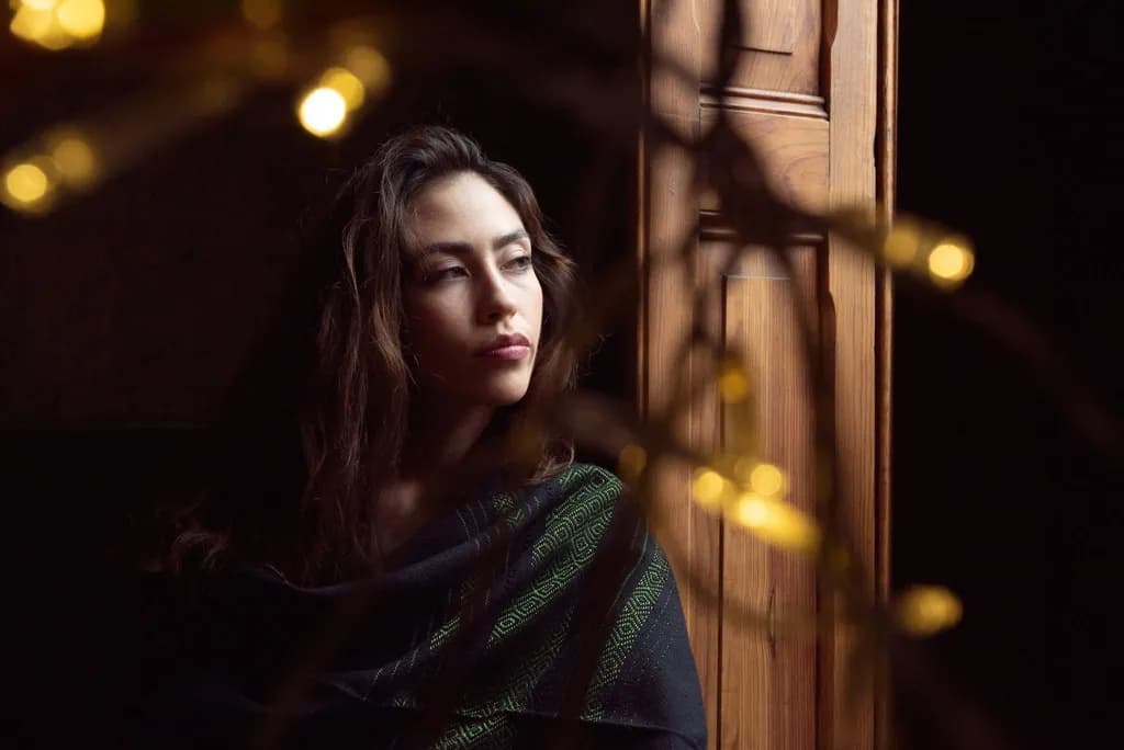Whispers of Light: A Contemplative Portrait in Shadows and Glow