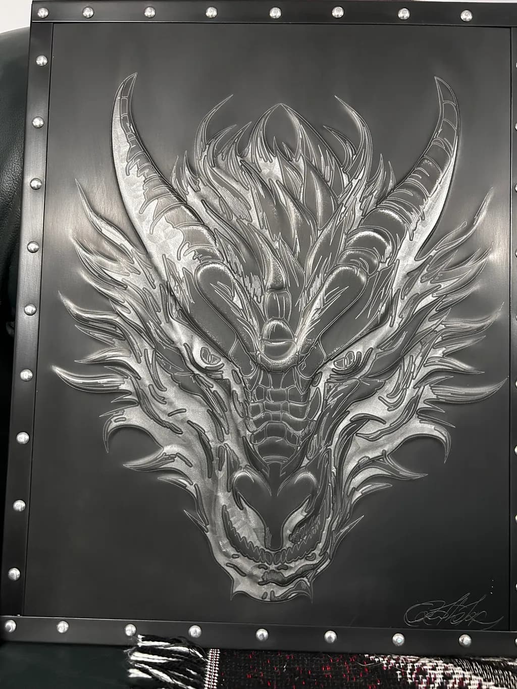 Majestic Dragon: A Stunning Metal Relief Sculpture of Power and Elegance