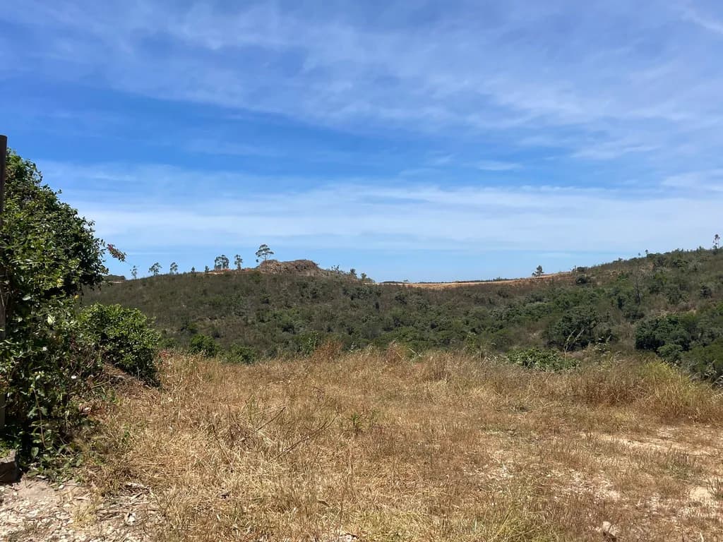 Whispers of the Hills: A Serene Landscape Under the Vast Sky