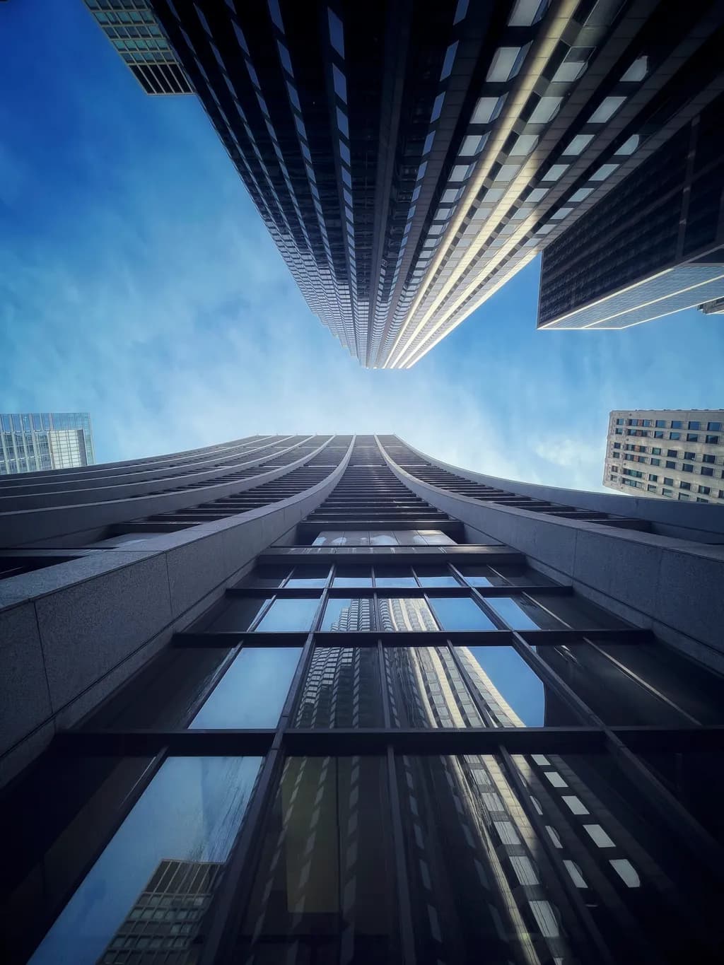 Urban Symphony: A Vertical Dance of Glass and Sky