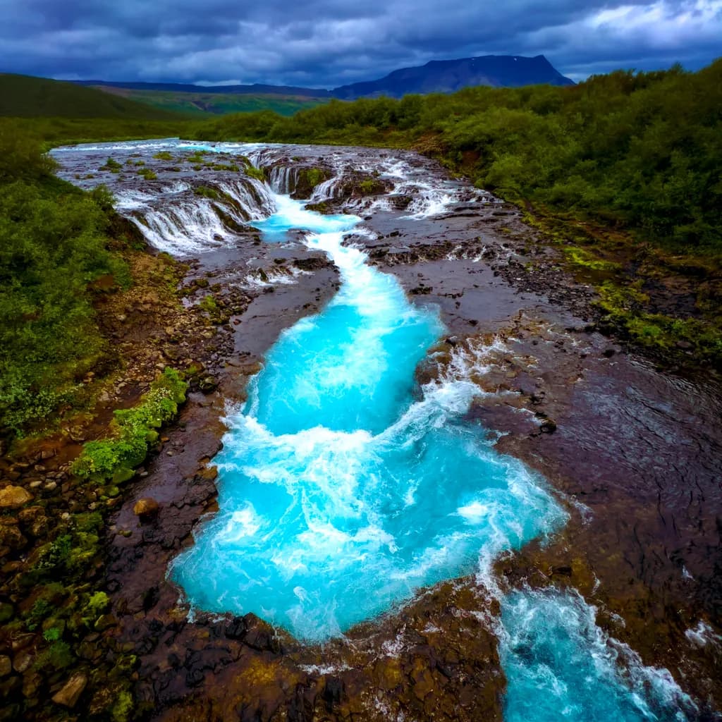 Serenity in Motion: The Enchanting Dance of Blue Waters and Cascading Falls