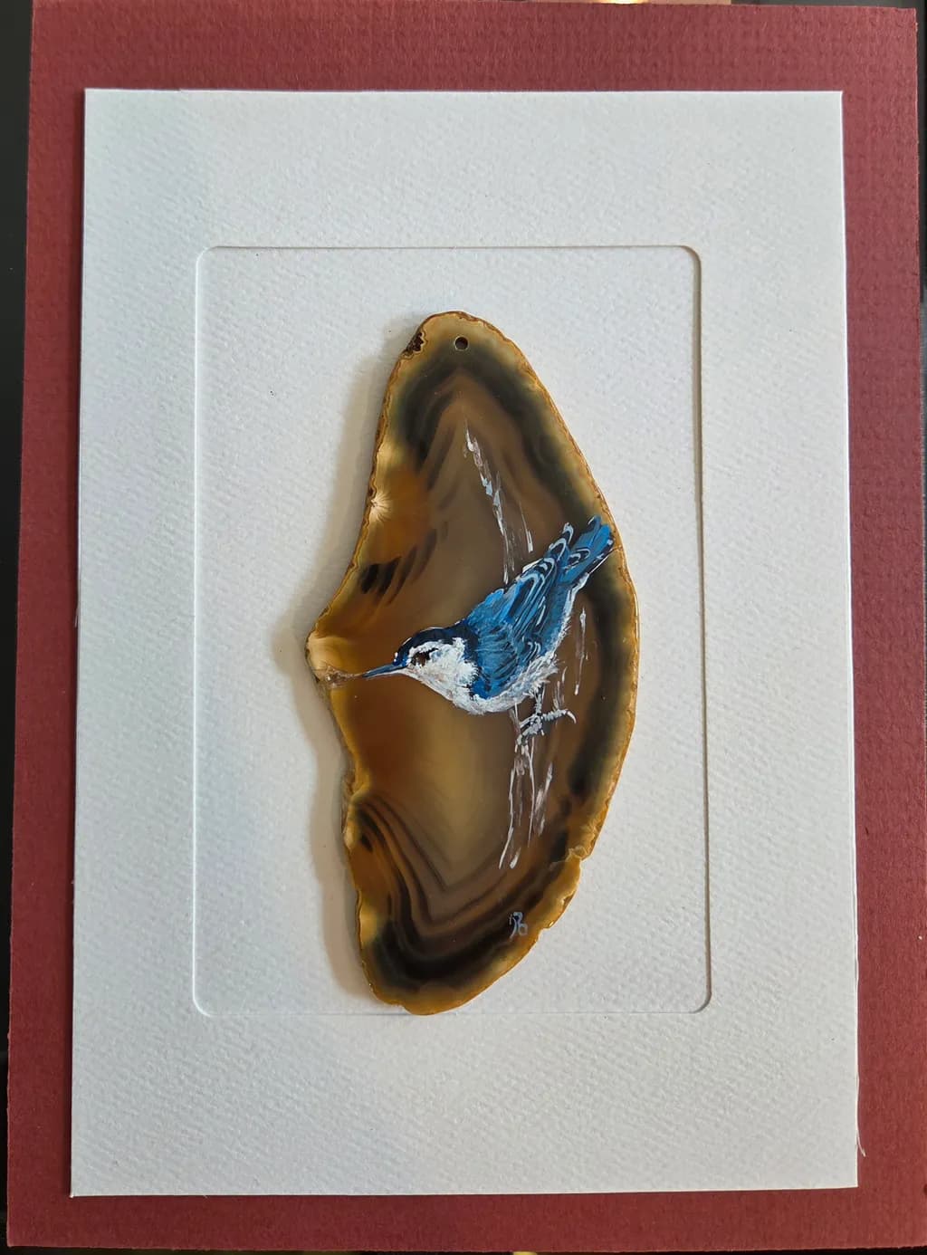 Whispers of Nature: A Bluebird's Elegance on Agate