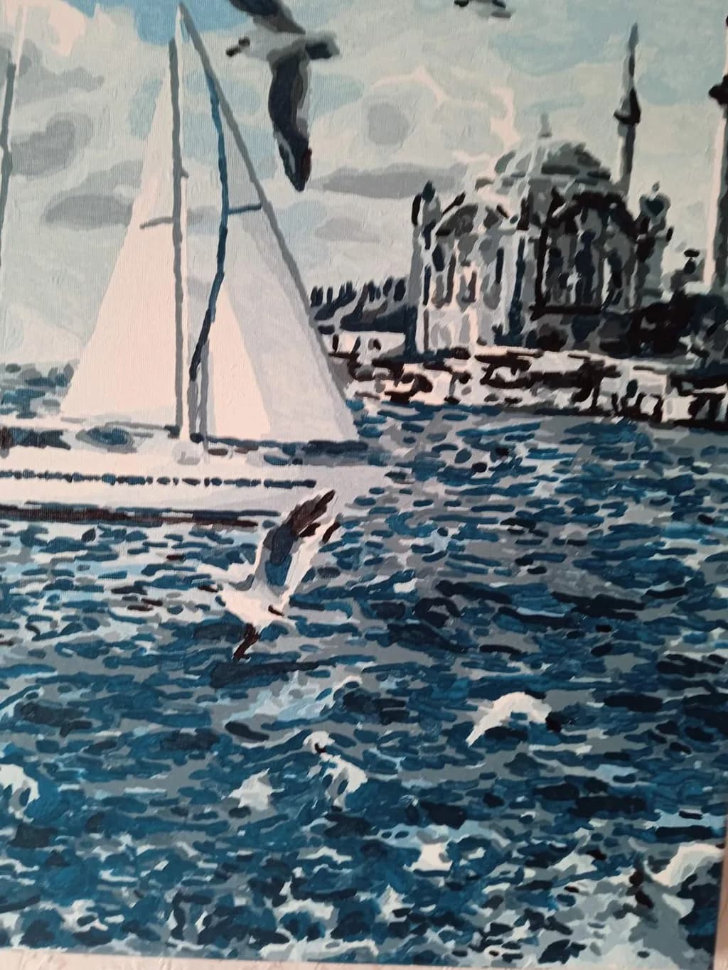 Serenity on the Waves: A Tranquil Sailing Scene Under a Blue Sky