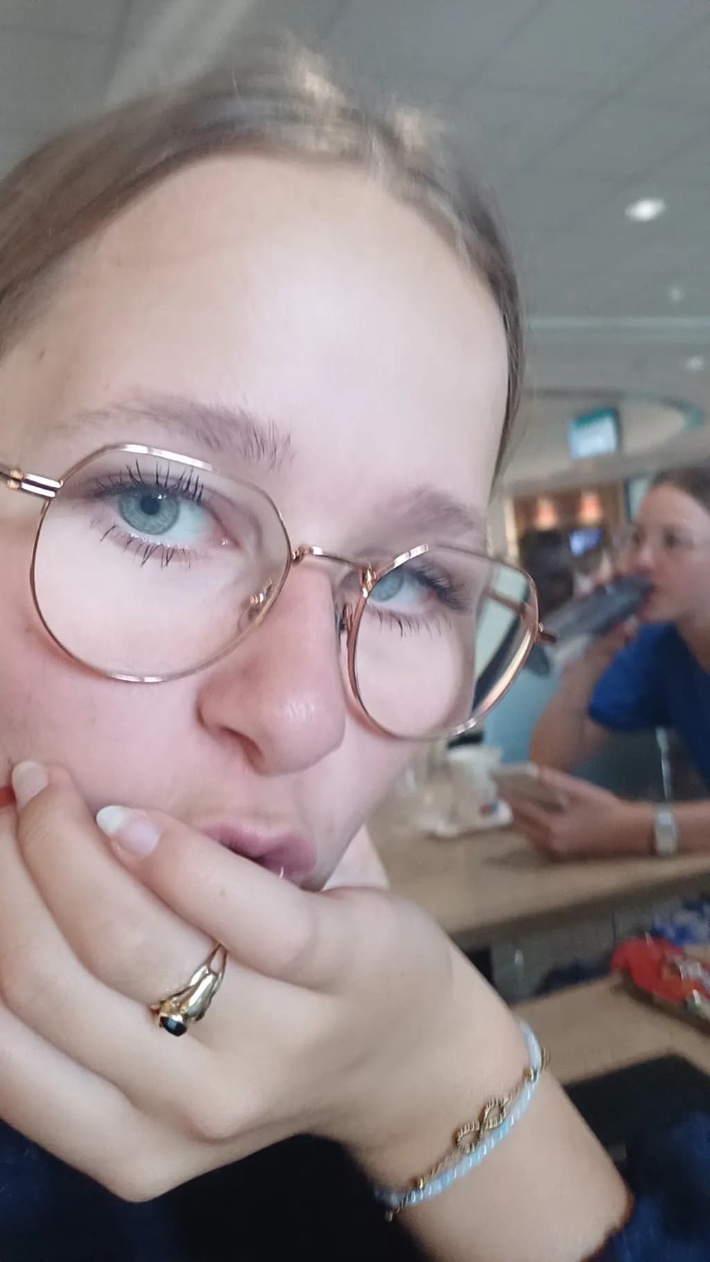 Whimsical Reflections: A Moment of Contemplation in a Busy Café